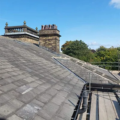 a group of people standing on top of a roof